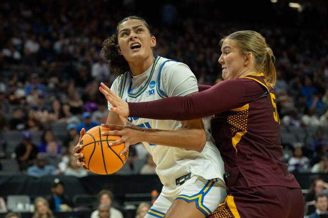 UCLA Bruins center Lauren Betts drives to the basket against Minnesota Golden Gophers center Sophie Hart during the NCAA Women’s Basketball Tournament Sweet 16 game at Golden 1 Center in Sacramento on Friday.